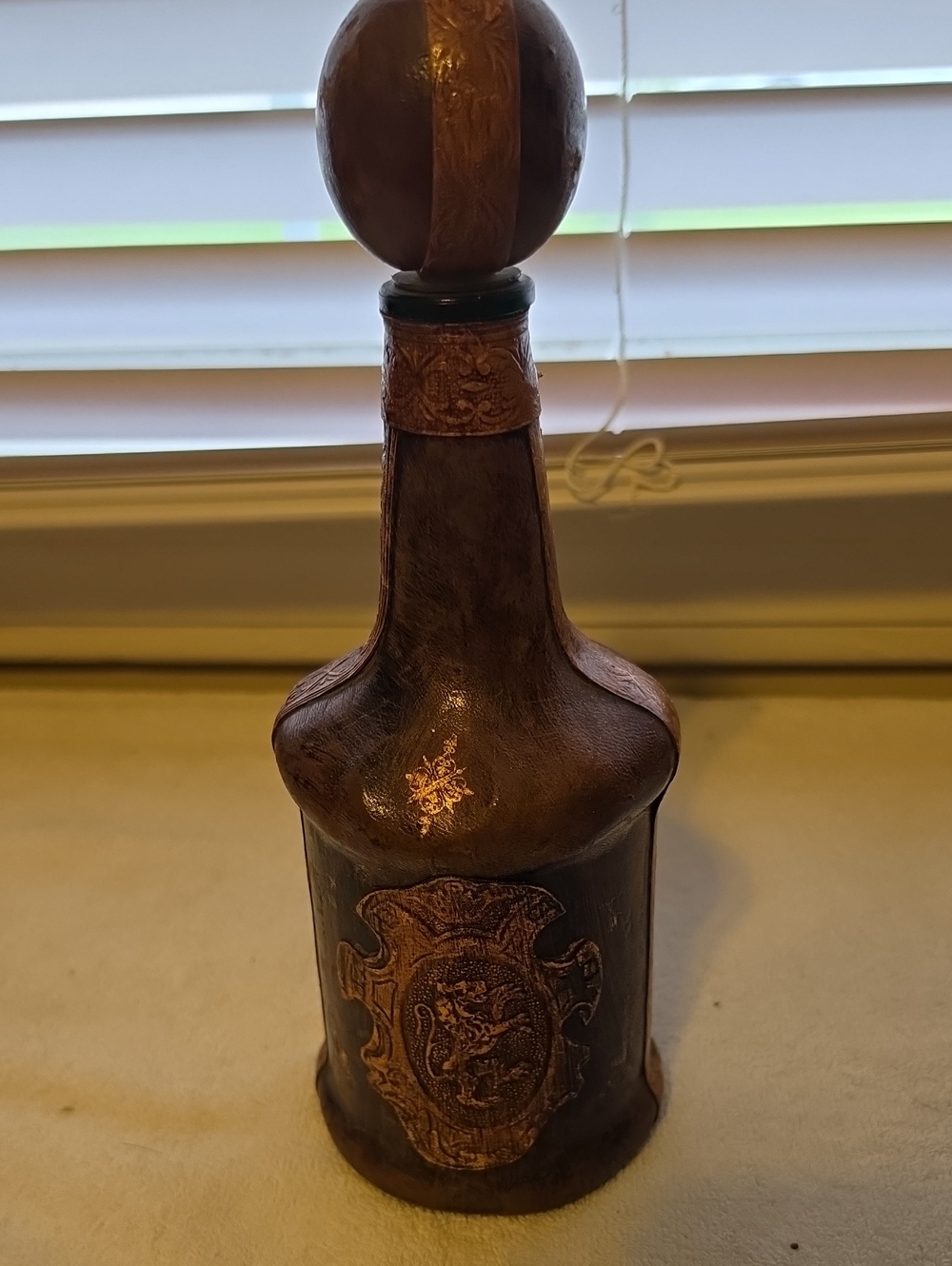 Decorative Brown Leather-Wrapped Bottle with Embossed Crest Made In Italy